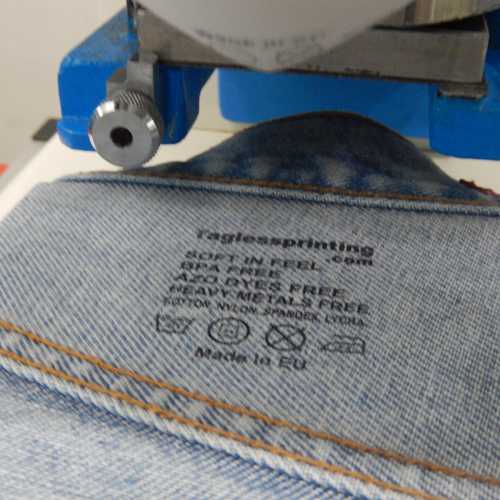 Tagless pad printing on denim jean