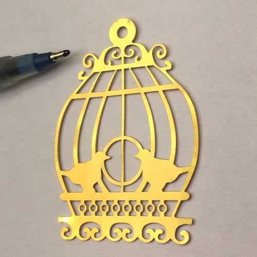 Laser cutting of cage on gold metal