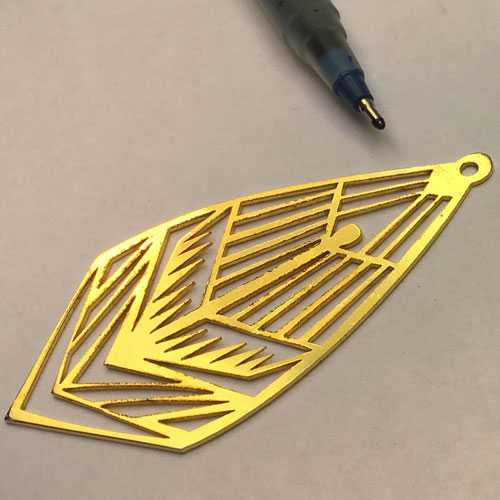 Sharp laser cutting on gold metal part