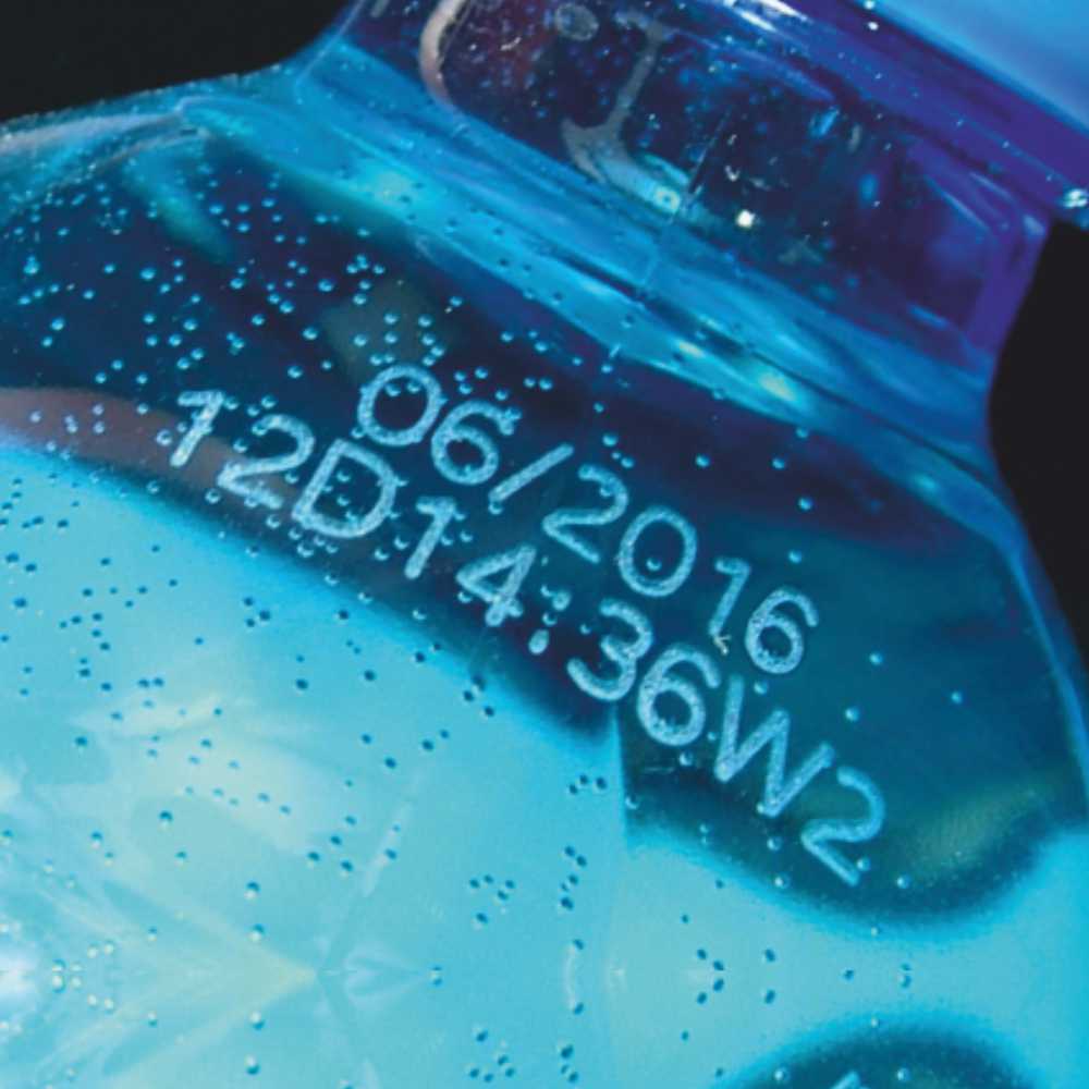 Laser marked batch code on plastic water bottle
